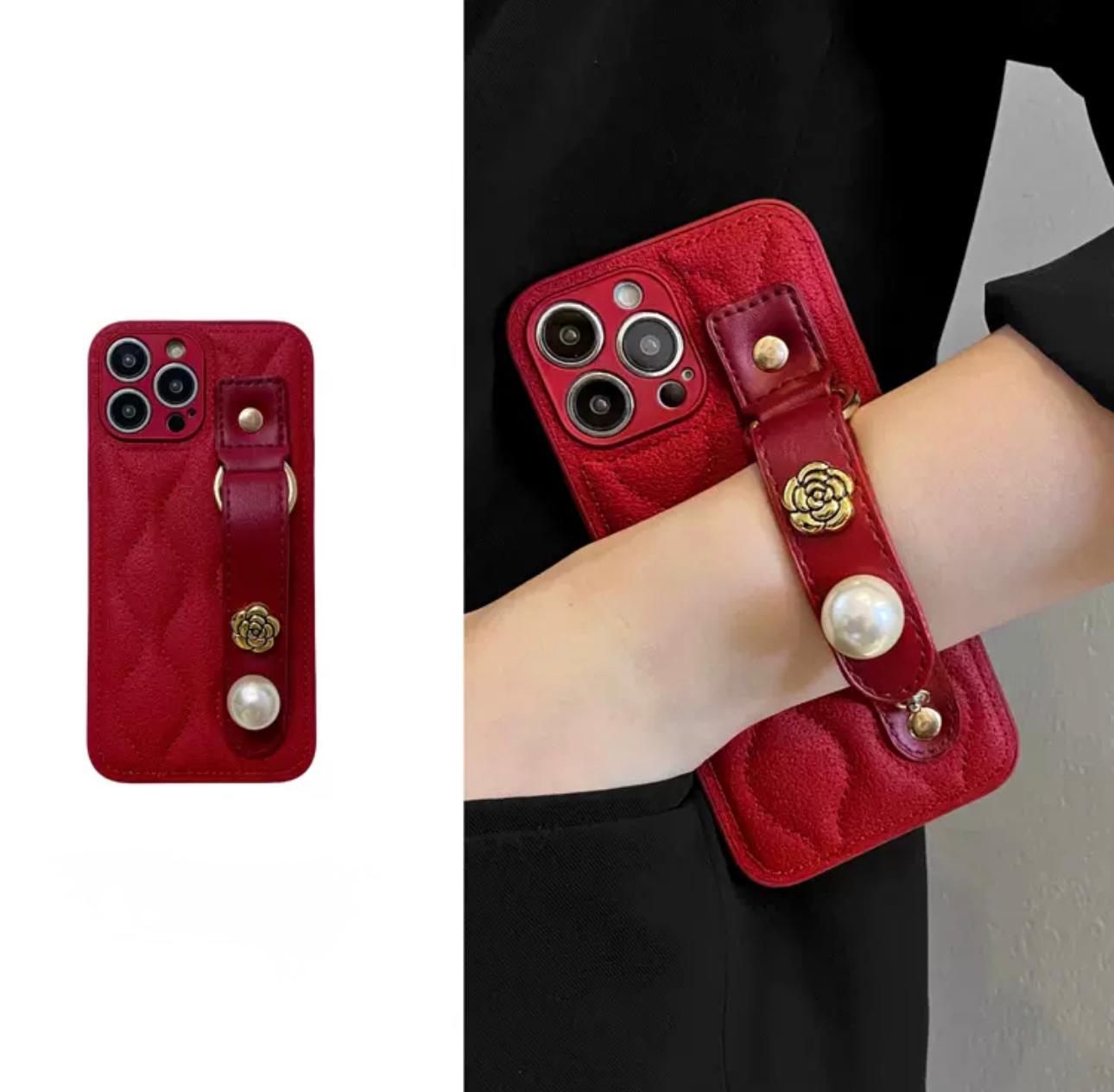Sparkling red case with hand strap for iphone